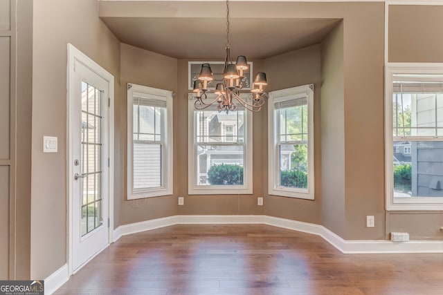 100 Harmony Ct, Dallas, GA 30157 - unfurnished dining area with wood finished floors, a chandelier, and baseboards