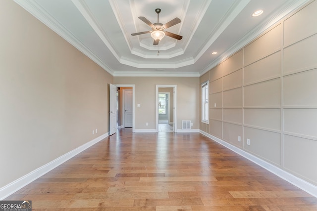 100 Harmony Ct, Dallas, GA 30157 - empty room with a raised ceiling, ceiling fan, light wood finished floors, ornamental molding, and baseboards