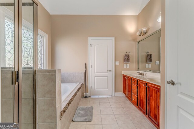 100 Harmony Ct, Dallas, GA 30157 - bathroom featuring double vanity, a bath, tile patterned floors, and baseboards