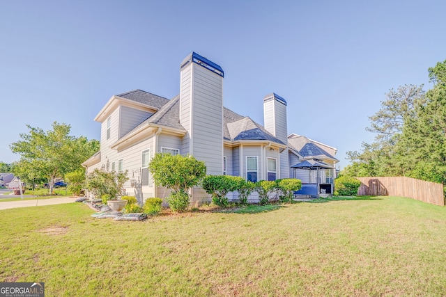 100 Harmony Ct, Dallas, GA 30157 - rear view of property featuring a chimney