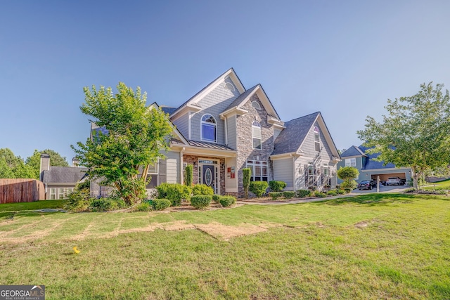 100 Harmony Ct, Dallas, GA 30157 - view of front of house with a standing seam roof, stone siding, a front yard, and metal roof