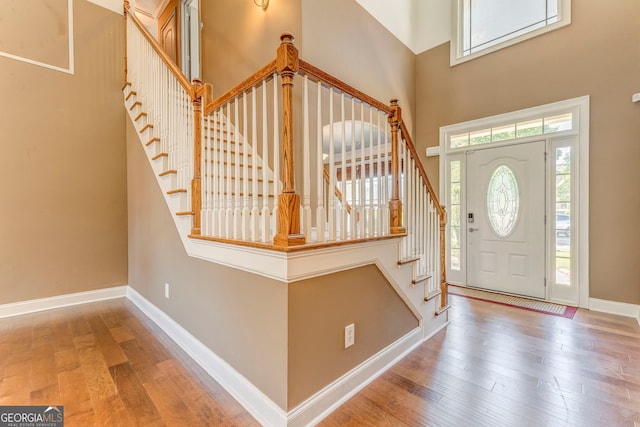 100 Harmony Ct, Dallas, GA 30157 - foyer entrance featuring a high ceiling, wood finished floors, stairs, and baseboards