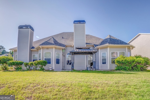 100 Harmony Ct, Dallas, GA 30157 - back of house featuring a chimney, a gazebo, and a lawn