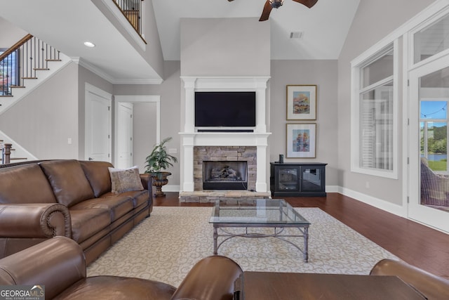 406 Vanderbilt Pkwy, Newnan, GA 30265 - living area with dark wood-style floors, ceiling fan, stairs, baseboards, and high vaulted ceiling