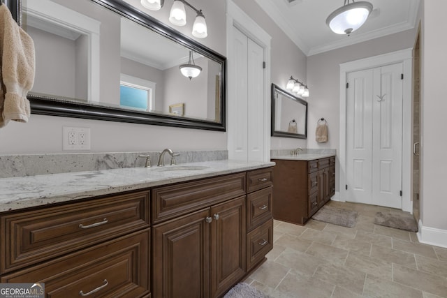 406 Vanderbilt Pkwy, Newnan, GA 30265 - full bath with two vanities, ornamental molding, baseboards, and stone finish flooring