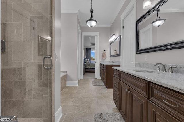 406 Vanderbilt Pkwy, Newnan, GA 30265 - full bathroom featuring ornamental molding, a shower stall, two vanities, baseboards, and ensuite bathroom