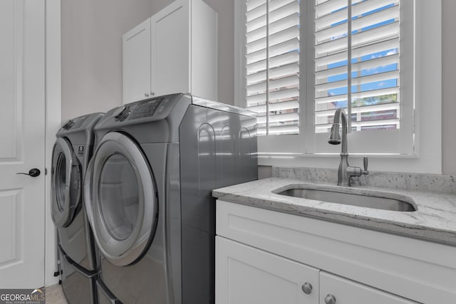 406 Vanderbilt Pkwy, Newnan, GA 30265 - laundry area featuring washing machine and dryer and cabinet space