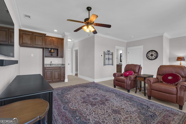 406 Vanderbilt Pkwy, Newnan, GA 30265 - living area with a ceiling fan, crown molding, baseboards, recessed lighting, and bar with sink