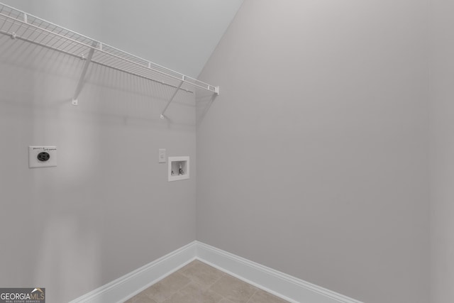 406 Vanderbilt Pkwy, Newnan, GA 30265 - laundry room featuring hookup for an electric dryer, baseboards, hookup for a washing machine, and light tile patterned flooring