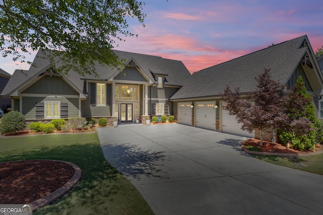 406 Vanderbilt Pkwy, Newnan, GA 30265 - craftsman-style house featuring french doors, driveway, a shingled roof, a front yard, and a garage