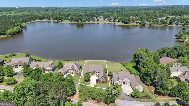 406 Vanderbilt Pkwy, Newnan, GA 30265 - aerial view of residential area featuring property boundaries highlighted, a nearby body of water, and a forest