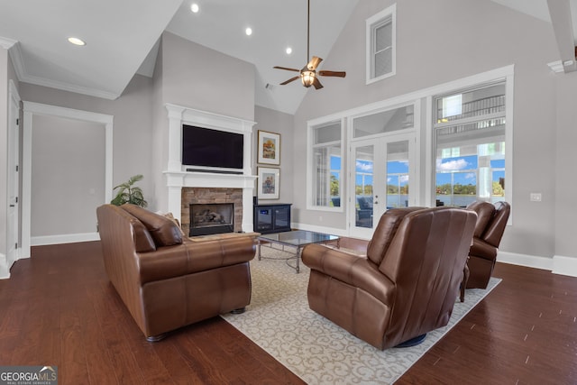 406 Vanderbilt Pkwy, Newnan, GA 30265 - living room featuring ceiling fan, high vaulted ceiling, a fireplace, baseboards, and wood finished floors