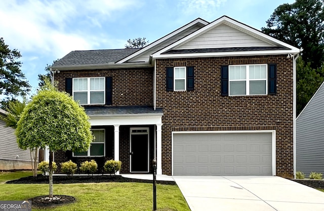 3993 Makeover Ct, South Fulton, GA 30349 - view of front of property with a garage, driveway, a shingled roof, brick siding, and a front yard