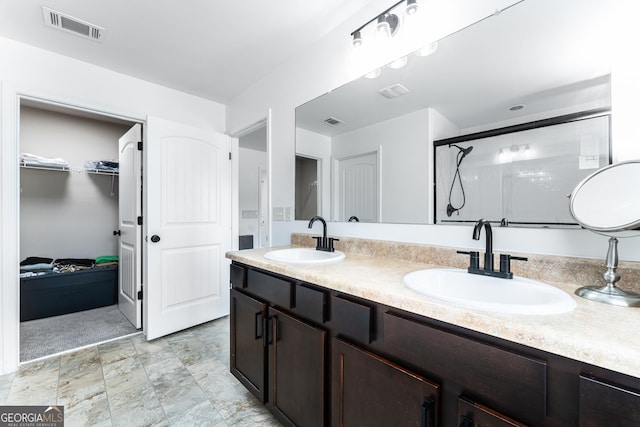3993 Makeover Ct, South Fulton, GA 30349 - bathroom with a spacious closet, double vanity, and an enclosed shower