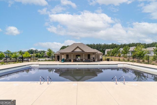 3993 Makeover Ct, South Fulton, GA 30349 - community pool featuring a patio
