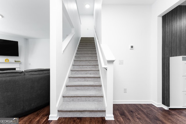 3993 Makeover Ct, South Fulton, GA 30349 - stairway featuring wood finished floors, baseboards, a fireplace, and recessed lighting
