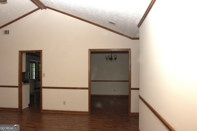 3857 Pointers Way SW, Conyers, GA 30094 - hall featuring vaulted ceiling, wood finished floors, crown molding, baseboards, and a textured ceiling