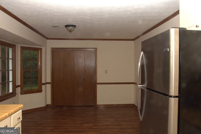 3857 Pointers Way SW, Conyers, GA 30094 - kitchen with freestanding refrigerator, dark wood-style flooring, baseboards, white cabinets, and light countertops