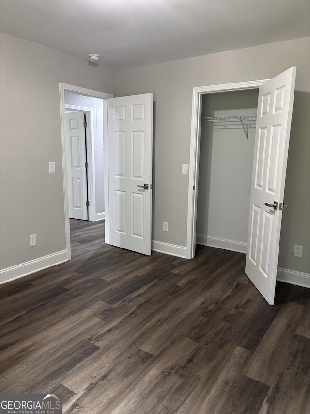 1030 Keller Rd, Mount Airy, GA 30563 - unfurnished bedroom featuring dark wood-style flooring and a closet