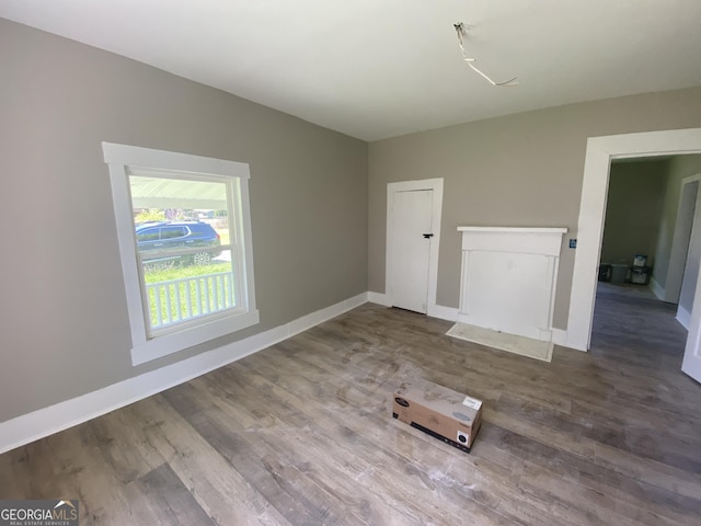 1 E 4th St, Aragon, GA 30104 - empty room with wood finished floors and baseboards