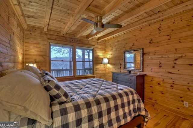 355 Cohutta Mountain Rd, Cherry Log, GA 30522 - bedroom featuring wooden ceiling with exposed beams, wood walls, and a ceiling fan