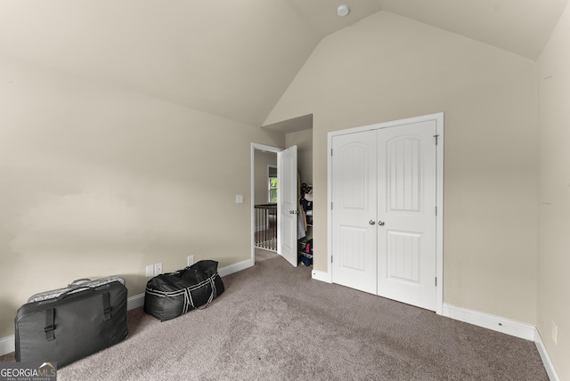 240 Somerset Dr, Dallas, GA 30132 - additional living space with carpet, high vaulted ceiling, and baseboards