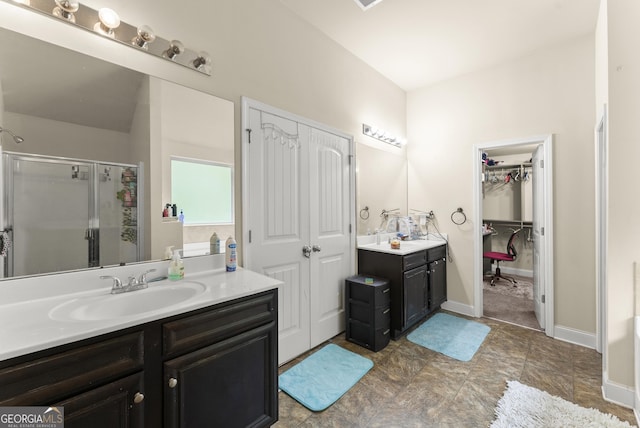 240 Somerset Dr, Dallas, GA 30132 - full bath with a shower stall, vanity, a spacious closet, and baseboards