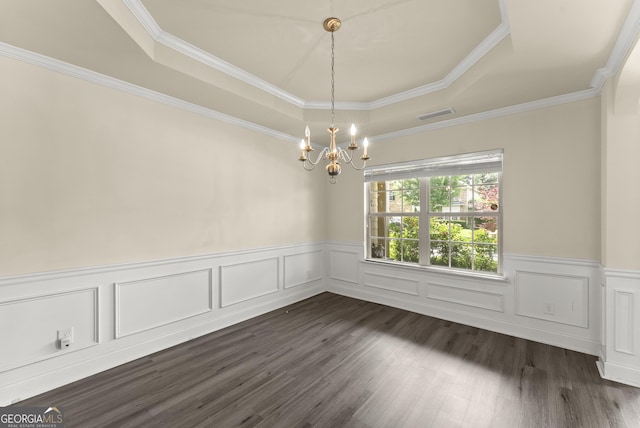 240 Somerset Dr, Dallas, GA 30132 - spare room featuring a raised ceiling, a chandelier, a wainscoted wall, dark wood finished floors, and ornamental molding