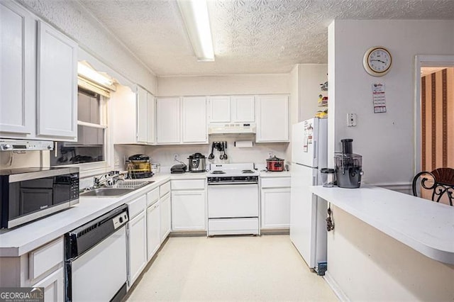 3244 Hampton Ct, Smyrna, GA 30082 - kitchen featuring white appliances, under cabinet range hood, a sink, white cabinetry, and light countertops