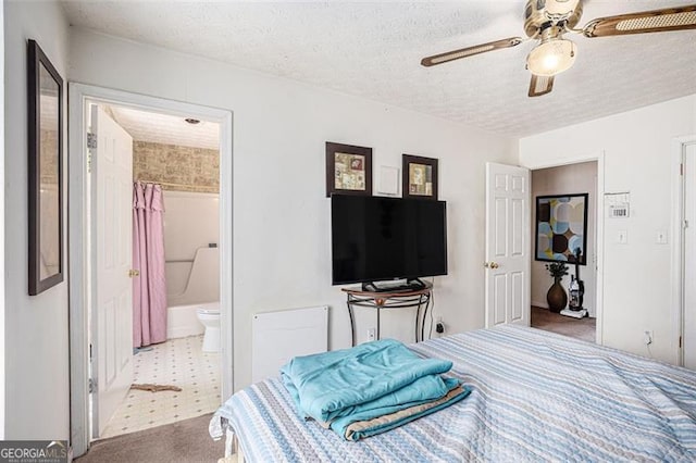 3244 Hampton Ct, Smyrna, GA 30082 - carpeted bedroom with a textured ceiling, ensuite bathroom, and ceiling fan
