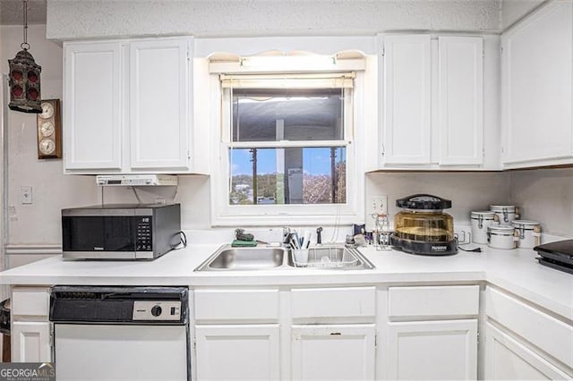 3244 Hampton Ct, Smyrna, GA 30082 - kitchen featuring stainless steel microwave, a sink, dishwasher, and white cabinets