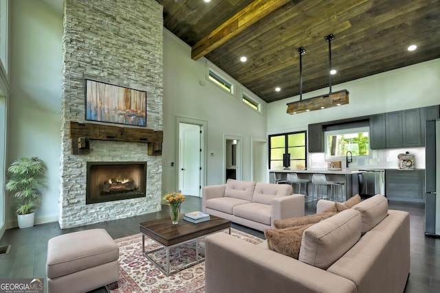 840 Arp Rd, Mineral Bluff, GA 30559 - living room with a fireplace, high vaulted ceiling, wood ceiling with exposed beams, dark wood-style floors, and baseboards