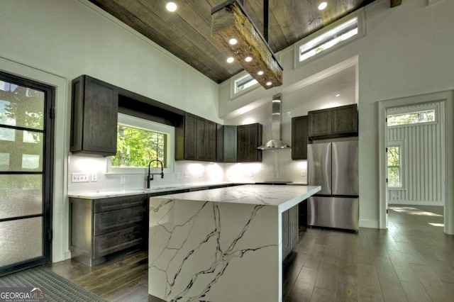 840 Arp Rd, Mineral Bluff, GA 30559 - kitchen featuring freestanding refrigerator, wall chimney range hood, wooden ceiling, a kitchen island, and a sink