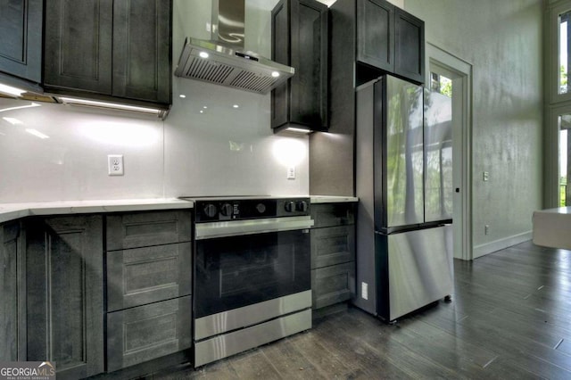 840 Arp Rd, Mineral Bluff, GA 30559 - kitchen featuring extractor fan, stainless steel appliances, dark wood-type flooring, light countertops, and baseboards