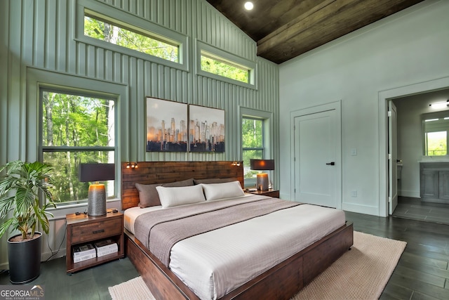 840 Arp Rd, Mineral Bluff, GA 30559 - bedroom featuring wood ceiling, high vaulted ceiling, ensuite bath, wood finished floors, and an accent wall