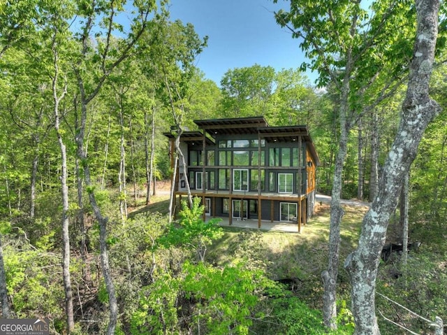 840 Arp Rd, Mineral Bluff, GA 30559 - rear view of house with a patio area, a deck, and a wooded view