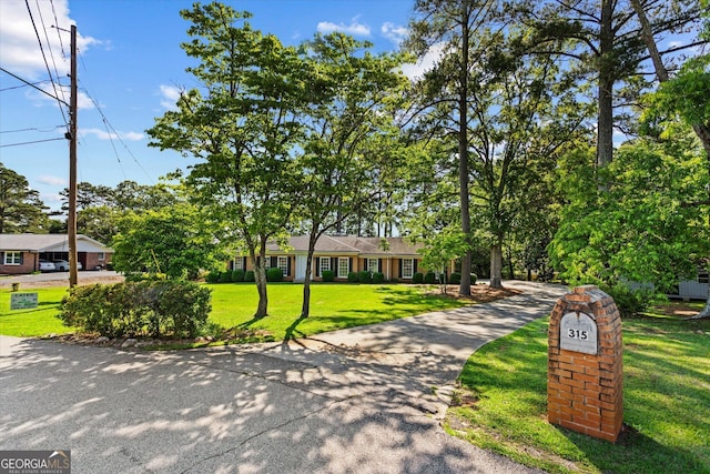 315 Burke Cir, Mcdonough, GA 30253 - ranch-style home featuring a front lawn