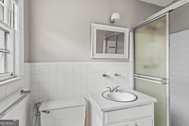 315 Burke Cir, Mcdonough, GA 30253 - bathroom with tile walls, toilet, a stall shower, and vanity