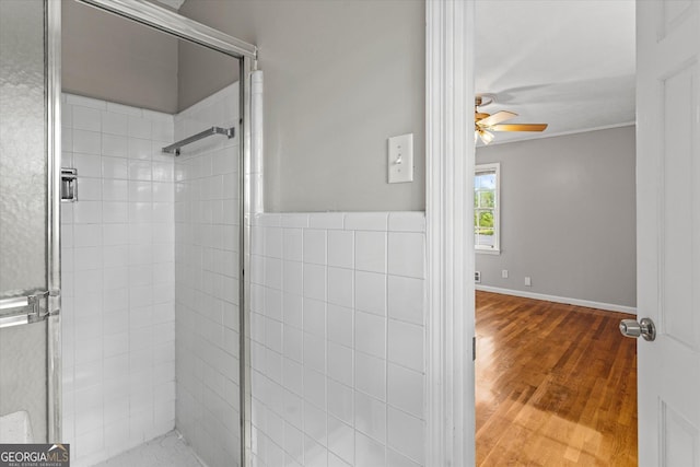 315 Burke Cir, Mcdonough, GA 30253 - bathroom featuring ceiling fan, a shower stall, wood finished floors, and crown molding