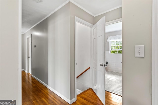 315 Burke Cir, Mcdonough, GA 30253 - corridor featuring wood finished floors, ornamental molding, an upstairs landing, and baseboards