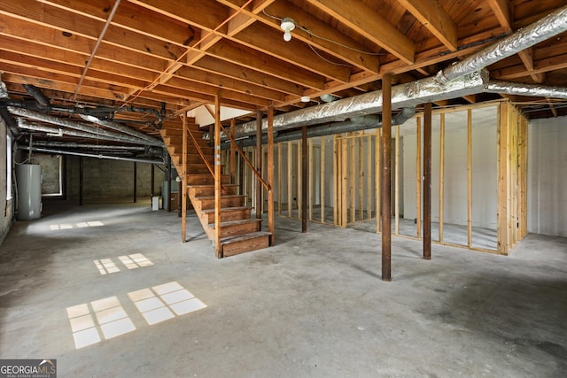 315 Burke Cir, Mcdonough, GA 30253 - unfinished below grade area featuring stairway and water heater