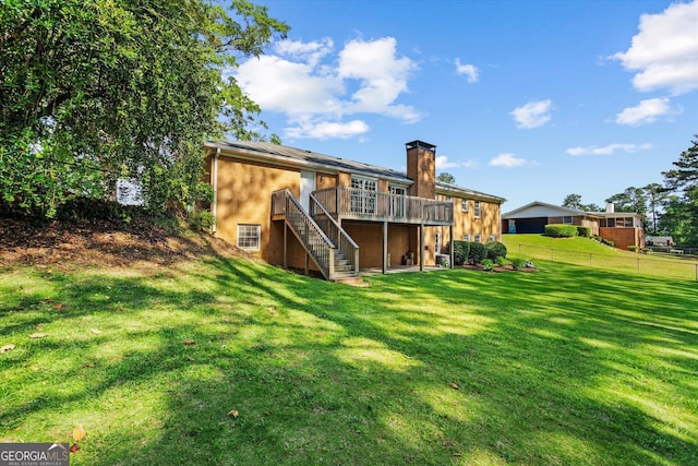 315 Burke Cir, Mcdonough, GA 30253 - rear view of property featuring stairs, a wooden deck, and a chimney
