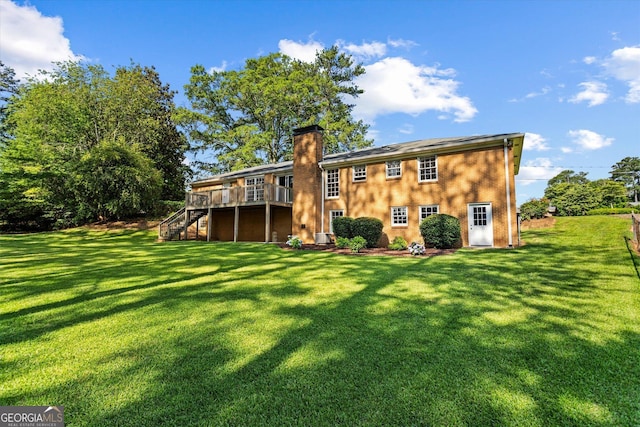 315 Burke Cir, Mcdonough, GA 30253 - rear view of house featuring stairway, a deck, a chimney, and a yard
