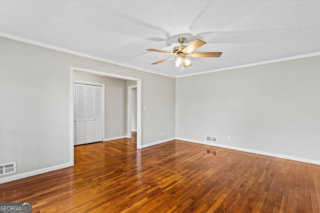 315 Burke Cir, Mcdonough, GA 30253 - spare room featuring ceiling fan, wood finished floors, baseboards, and crown molding