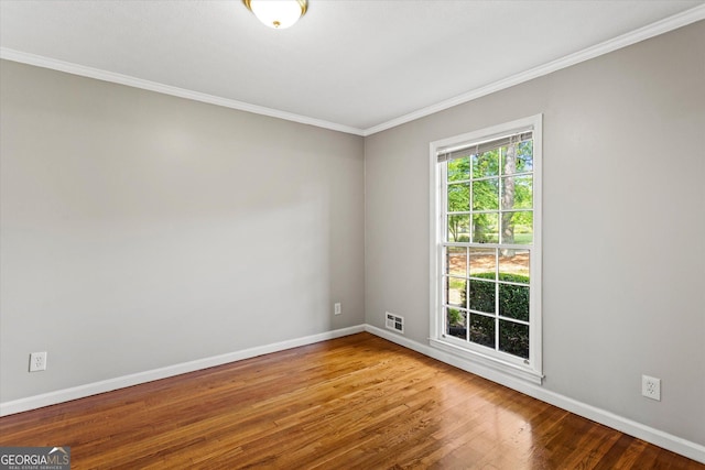315 Burke Cir, Mcdonough, GA 30253 - unfurnished room with crown molding, baseboards, and wood finished floors