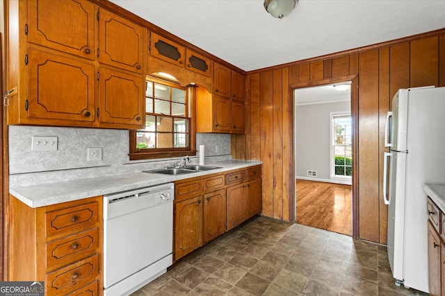 315 Burke Cir, Mcdonough, GA 30253 - kitchen with white appliances, a sink, backsplash, light countertops, and brown cabinetry