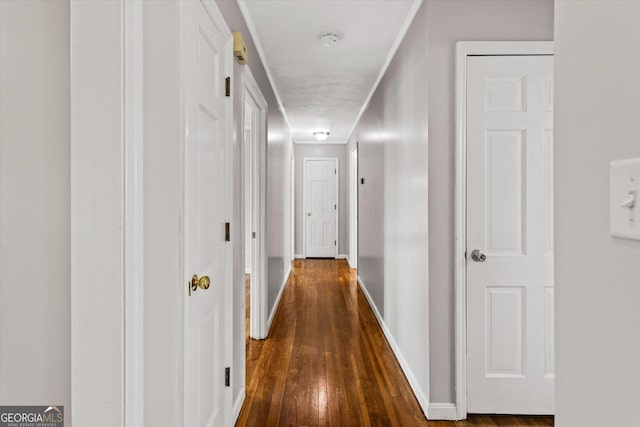 315 Burke Cir, Mcdonough, GA 30253 - hall featuring dark wood-style flooring and baseboards