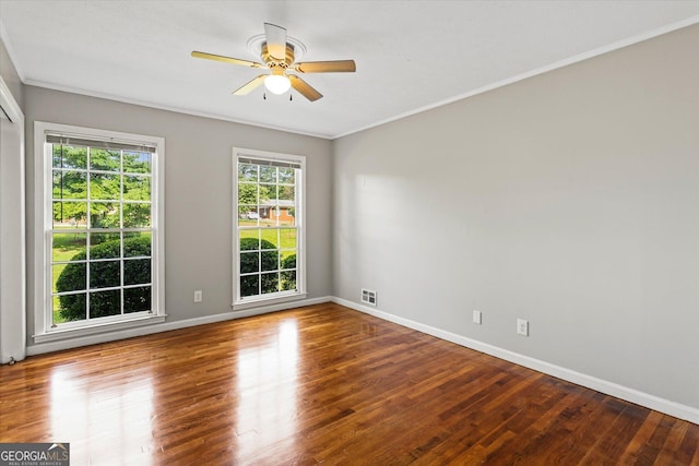 315 Burke Cir, Mcdonough, GA 30253 - spare room featuring a ceiling fan, baseboards, wood finished floors, and ornamental molding