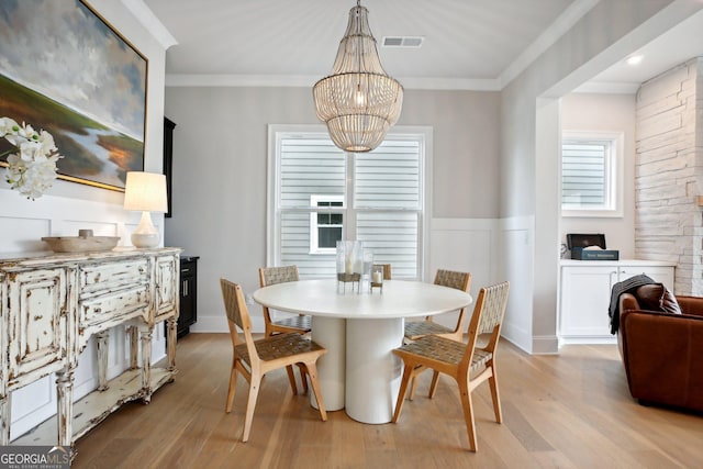 247 Widener Way, Peachtree City, GA 30269 - dining room with a chandelier, light wood finished floors, and ornamental molding