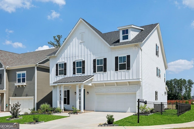247 Widener Way, Peachtree City, GA 30269 - view of front of home featuring an attached garage, driveway, board and batten siding, a shingled roof, and a standing seam roof